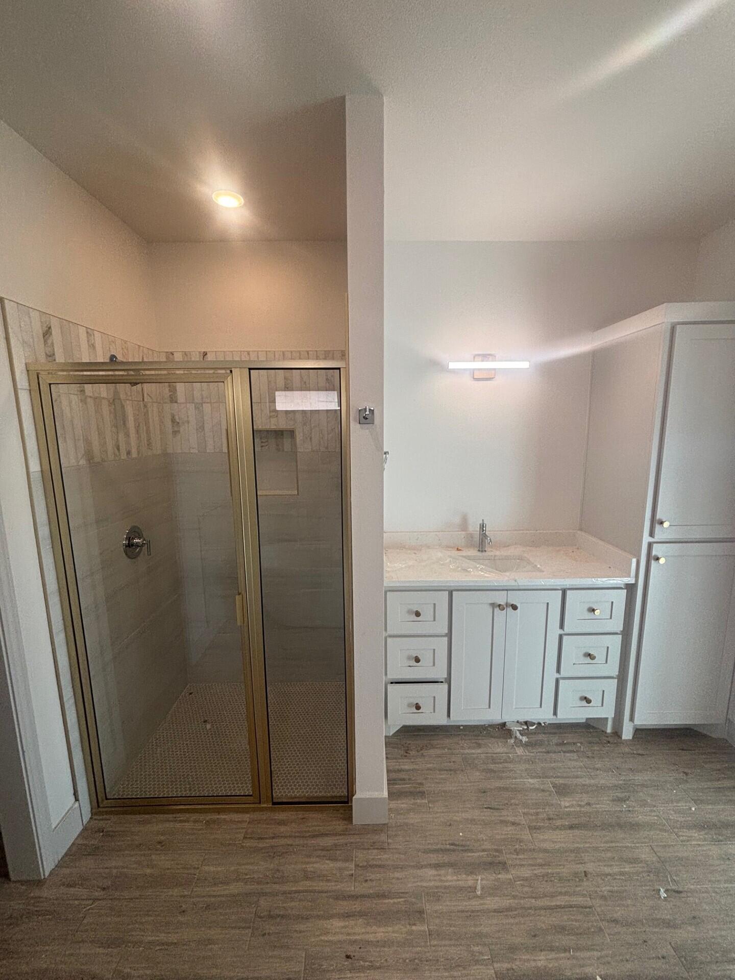 3616 119th Street Lubbock, TX 79423 - Photo 5 of 9 a view of a refrigerator in kitchen and white cabinets