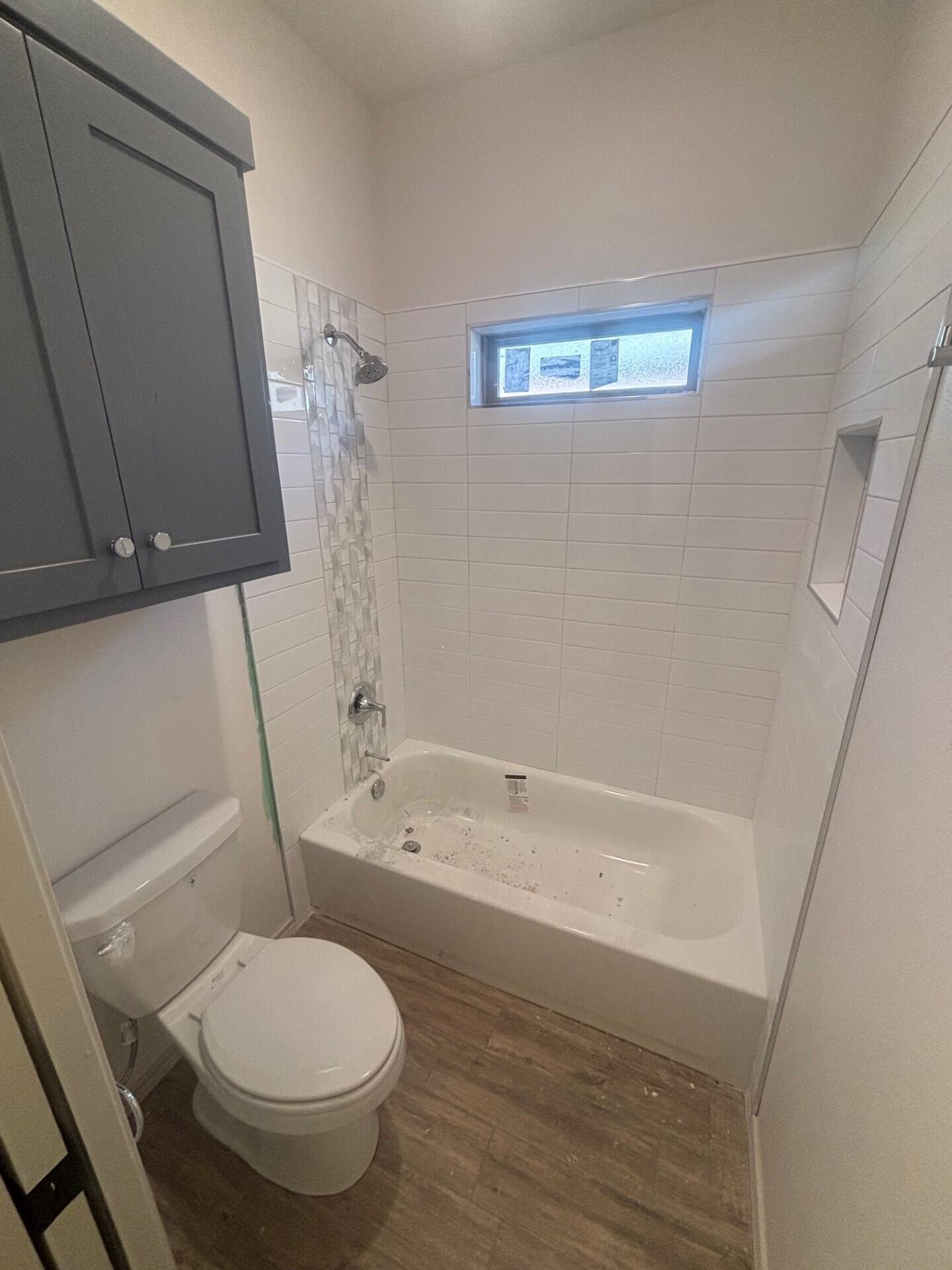 3616 119th Street Lubbock, TX 79423 - Photo 8 of 9 a bathroom with a sink and a toilet