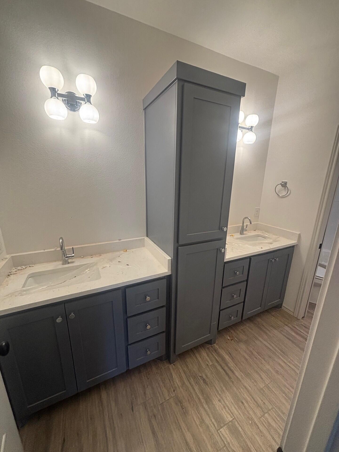 3616 119th Street Lubbock, TX 79423 - Photo 9 of 9 a bathroom with a double vanity sink and mirror