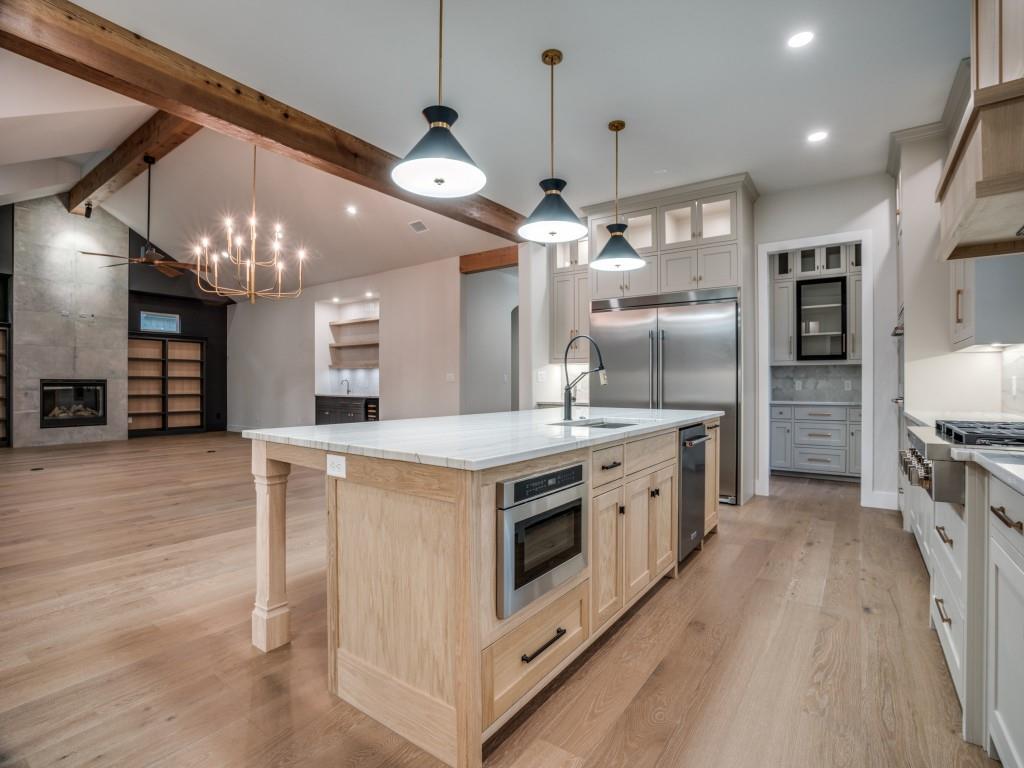 2424 Bellview Circle Tyler, TX 75709 - Photo 11 of 39 a large kitchen with stainless steel appliances a stove oven and a kitchen island