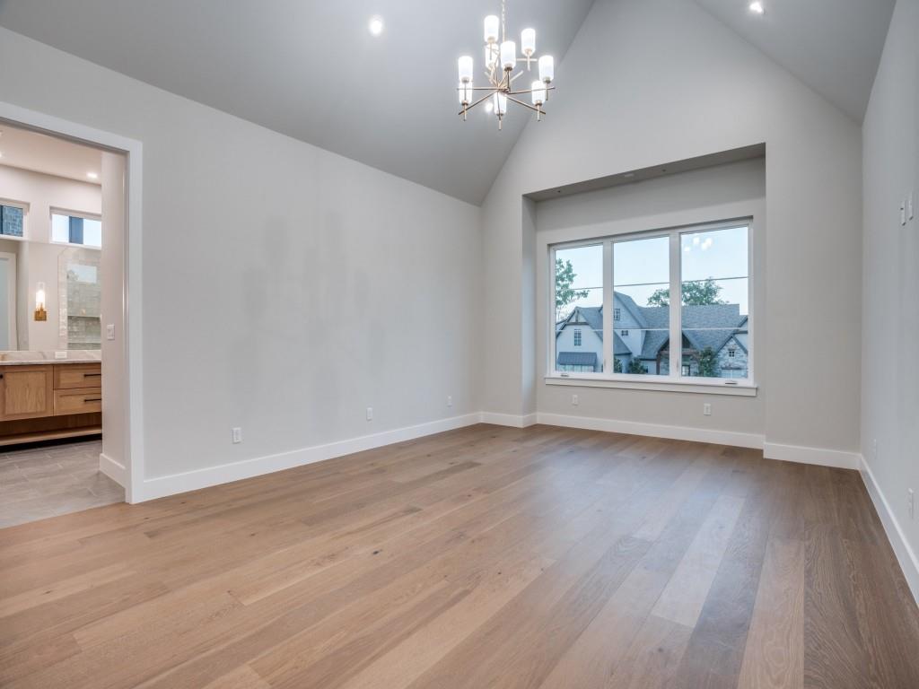 2424 Bellview Circle Tyler, TX 75709 - Photo 16 of 39 a view of an empty room with wooden floor and a window
