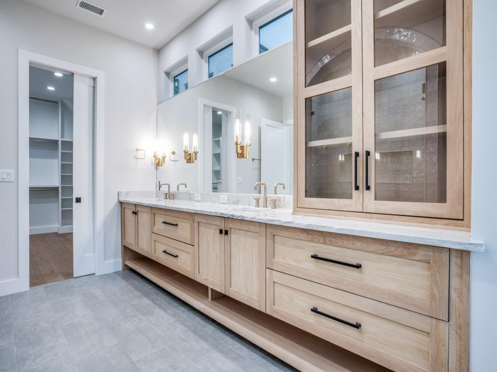 2424 Bellview Circle Tyler, TX 75709 - Photo 19 of 39 a bathroom with a sink and a mirror