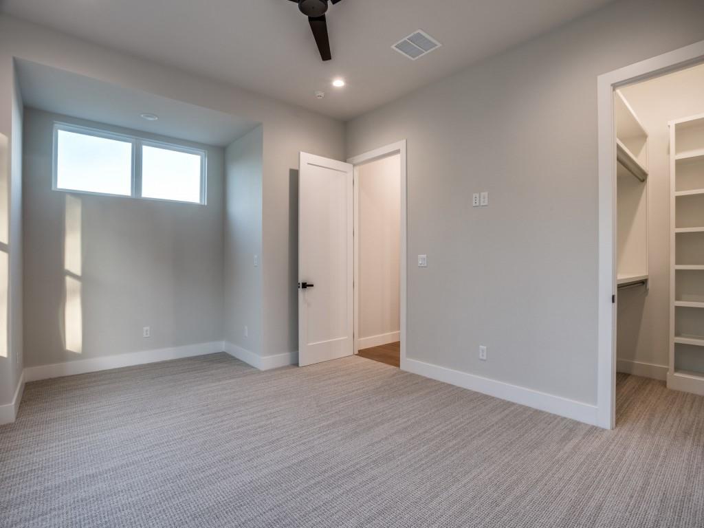 2424 Bellview Circle Tyler, TX 75709 - Photo 23 of 39 an empty room with wooden floor and windows