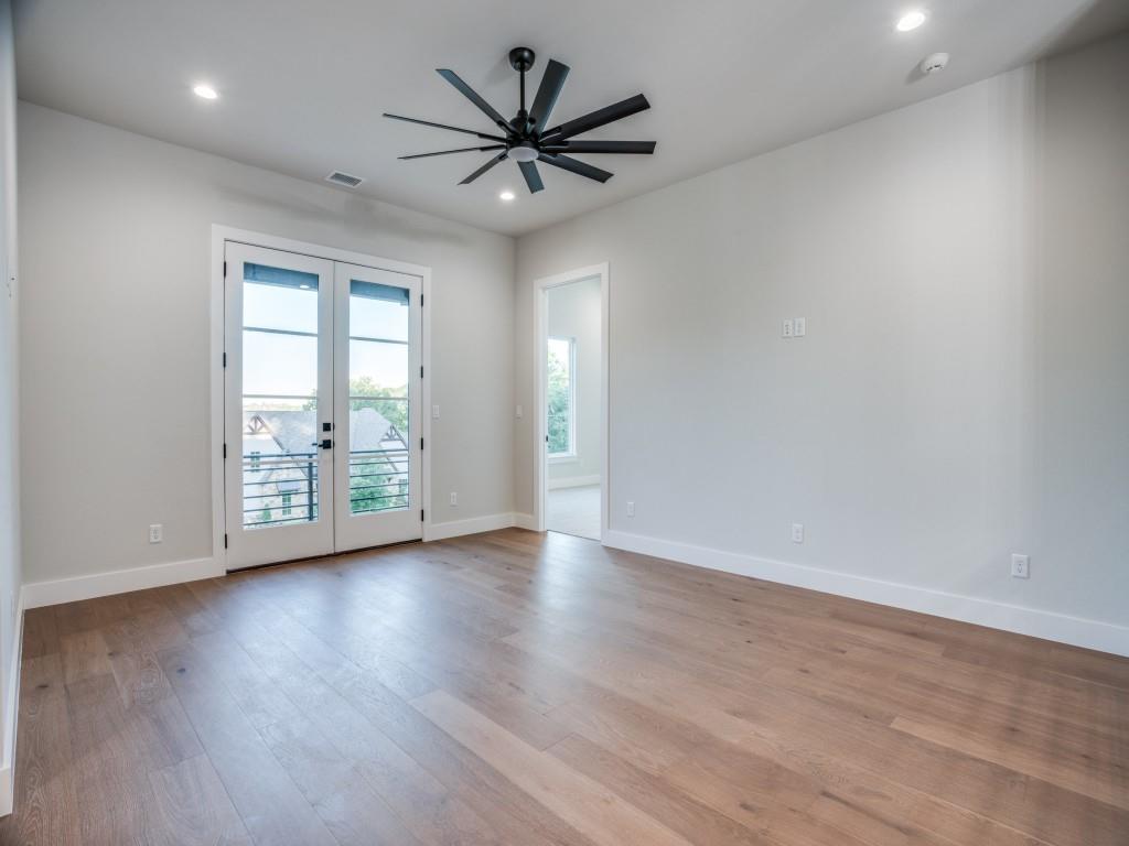 2424 Bellview Circle Tyler, TX 75709 - Photo 25 of 39 an empty room with wooden floor and windows
