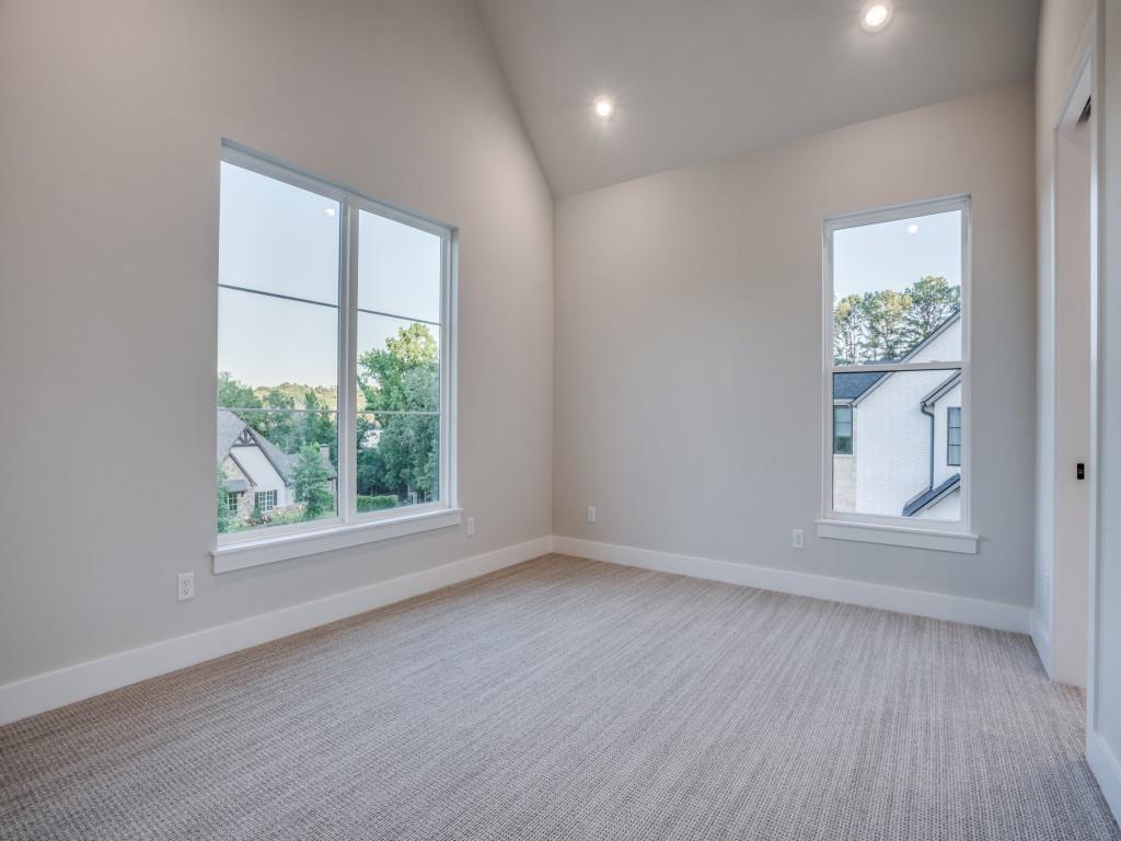 2424 Bellview Circle Tyler, TX 75709 - Photo 29 of 39 an empty room with wooden floor and windows