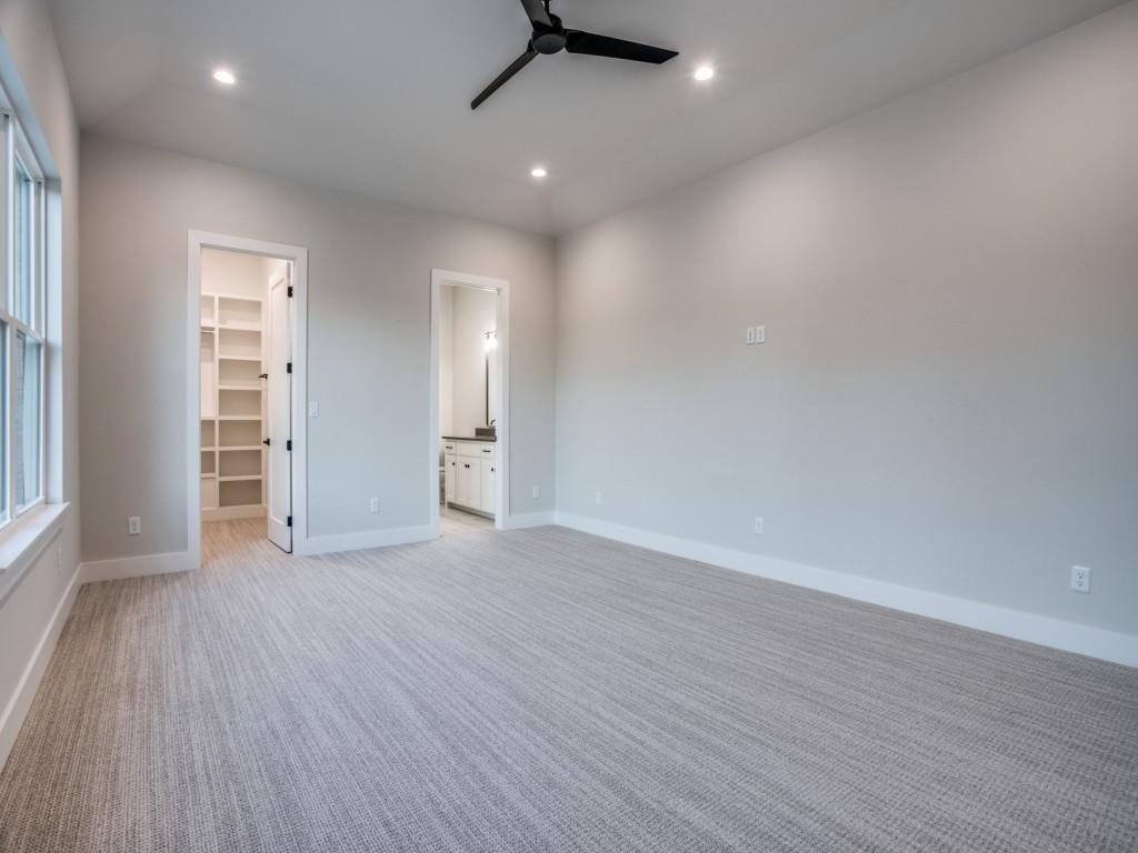 2424 Bellview Circle Tyler, TX 75709 - Photo 32 of 39 an empty room with wooden floor and windows