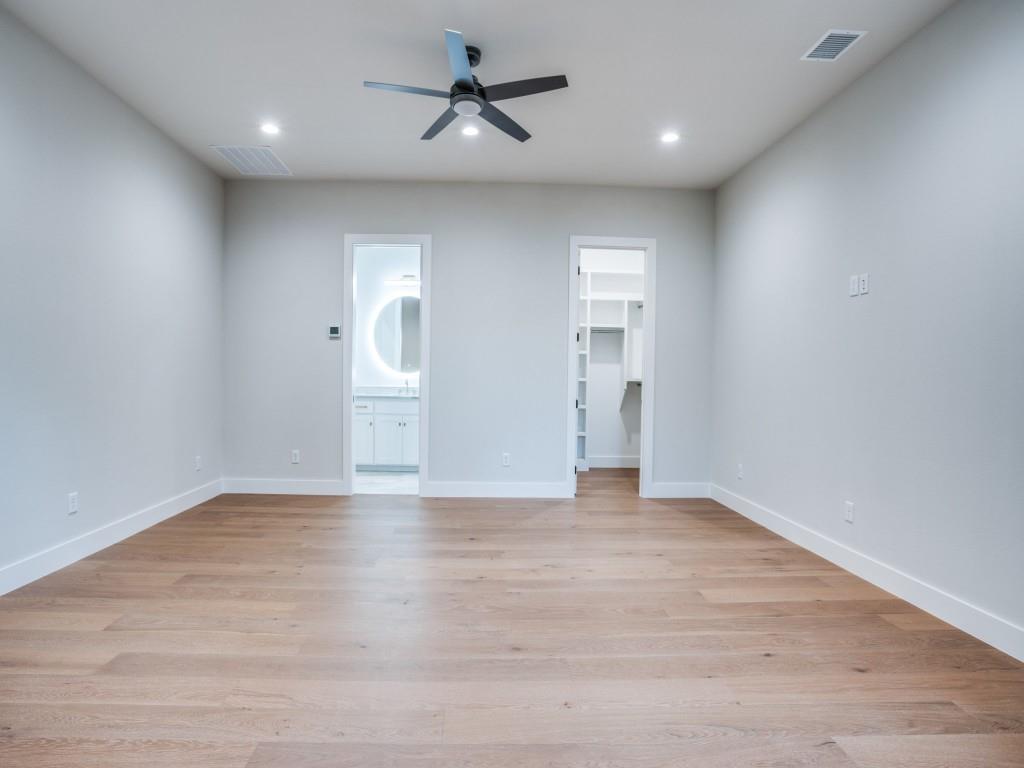 2424 Bellview Circle Tyler, TX 75709 - Photo 34 of 39 a view of empty room with wooden floor and ceiling fan