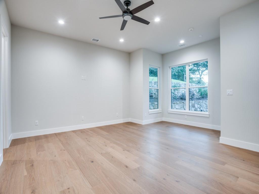 2424 Bellview Circle Tyler, TX 75709 - Photo 35 of 39 an empty room with wooden floor and windows