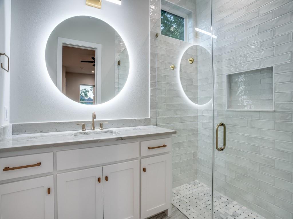 2424 Bellview Circle Tyler, TX 75709 - Photo 36 of 39 a bathroom with a granite countertop sink mirror and vanity