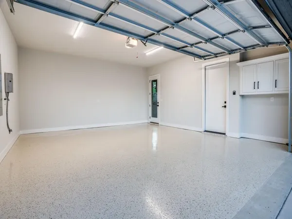 a large room with a large window and kitchen view