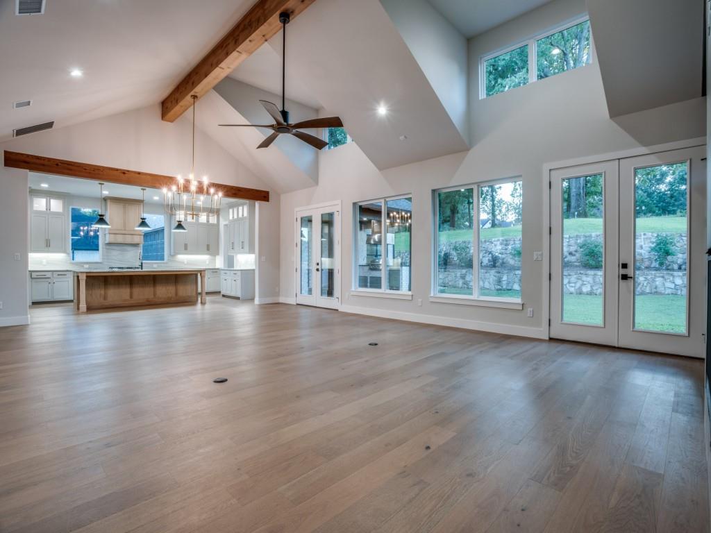 2424 Bellview Circle Tyler, TX 75709 - Photo 7 of 39 an empty room with wooden floor and windows