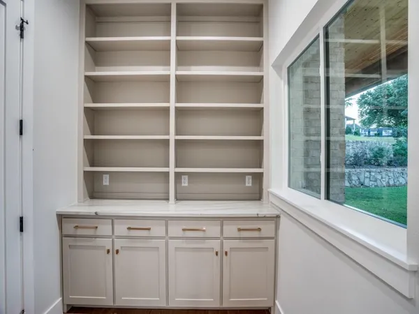 a large kitchen with stainless steel appliances a stove oven and a kitchen island
