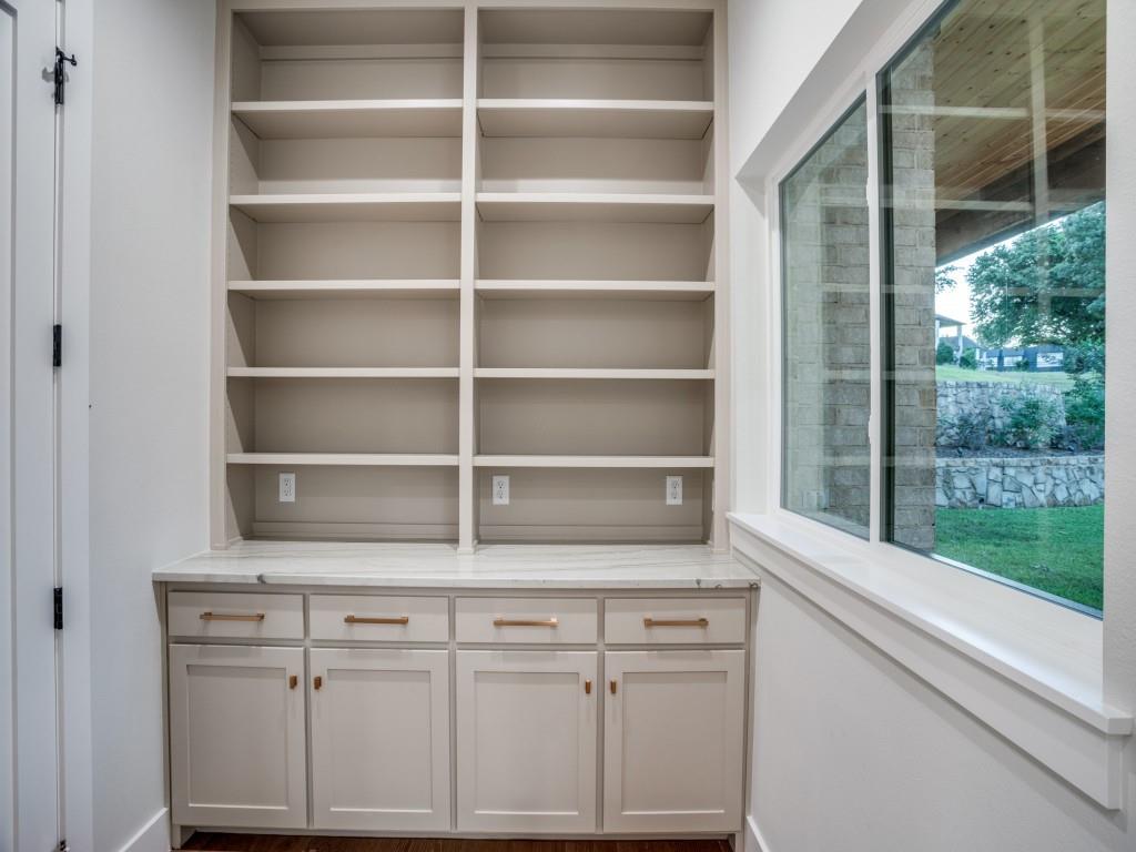 2424 Bellview Circle Tyler, TX 75709 - Photo 10 of 39 a room with cabinets and a window