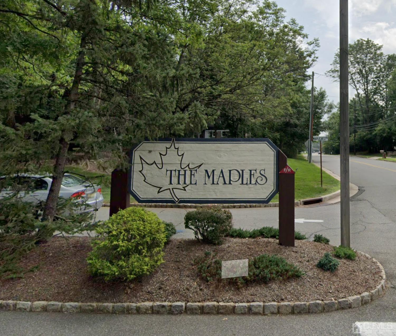 504 Maplecrest Road Edison, NJ 08820 - Photo 1 of 19 a sign on the side of a building
