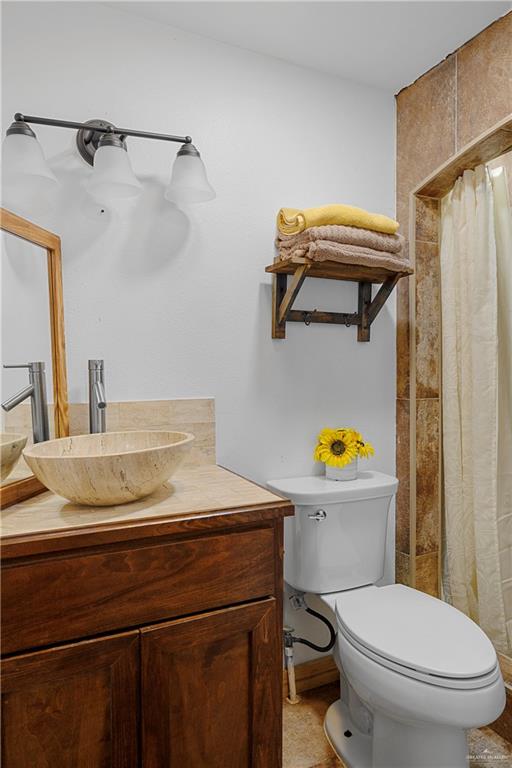 32447 Farm To Market Road 2925 Rio Hondo, TX 78583 - Photo 16 of 25 Full bathroom with vanity and toilet