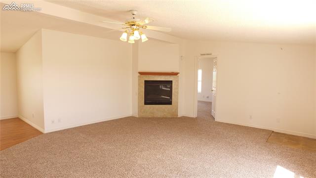 5710 Prospero Road Peyton, CO 80831 - Photo 13 of 34 Family Room With Gas Fireplace