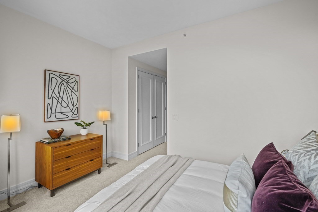 1 Avery Street, Unit U19D Boston, MA 02111 - Photo 19 of 27 a bedroom with a bed and a closet
