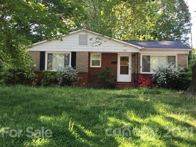 3633 Kempton Place Charlotte, NC 28208 - Photo 1 of 32 a front view of a house with garden