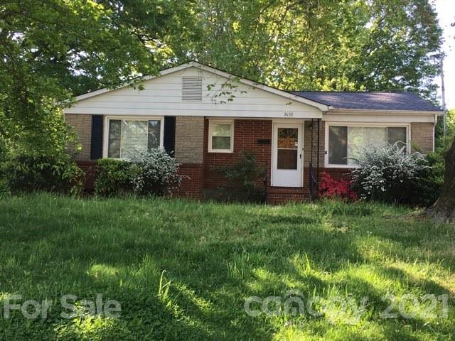 3633 Kempton Place Charlotte, NC 28208 - Photo 2 of 32 a front view of a house with garden