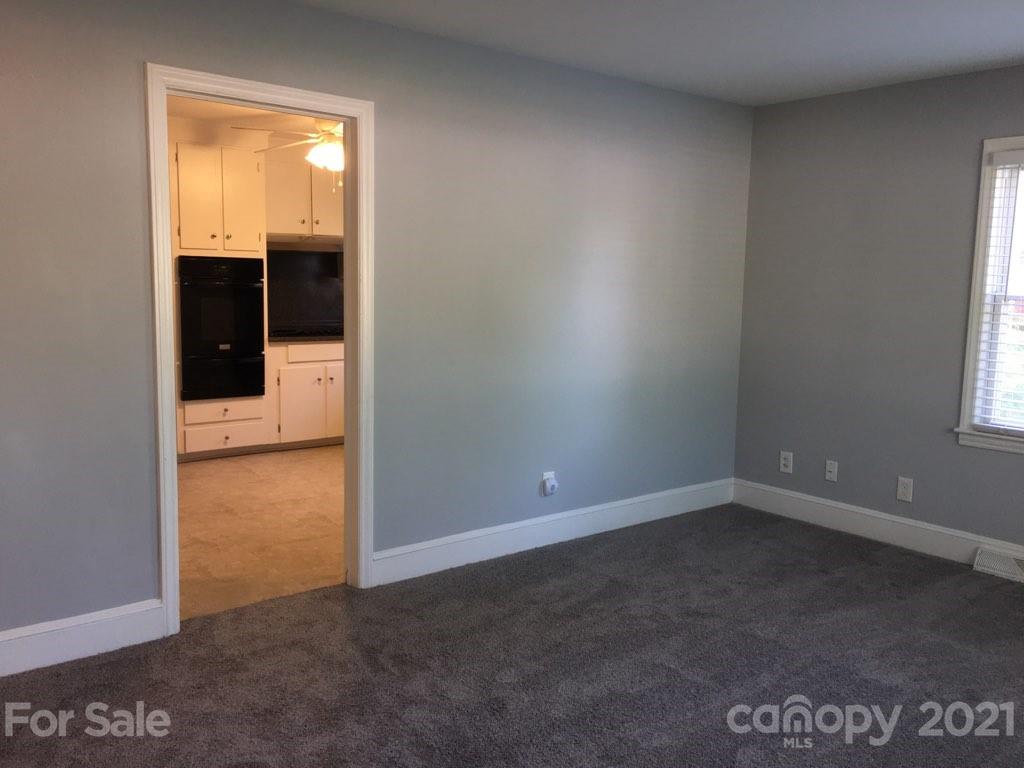 3633 Kempton Place Charlotte, NC 28208 - Photo 11 of 32 an empty room with windows