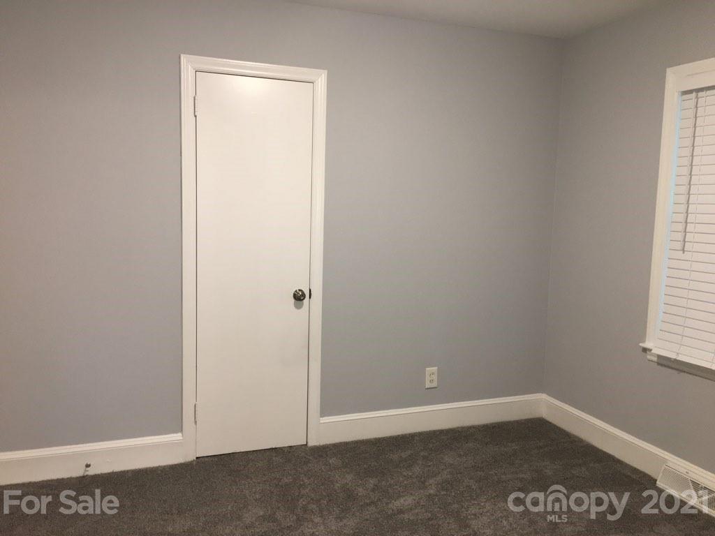 3633 Kempton Place Charlotte, NC 28208 - Photo 14 of 32 an empty room with a window