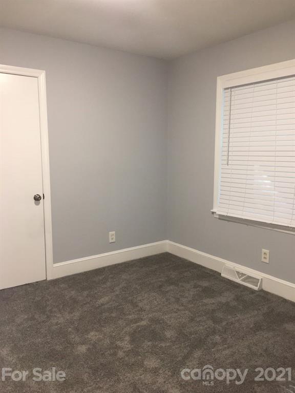 3633 Kempton Place Charlotte, NC 28208 - Photo 15 of 32 an empty room with a window