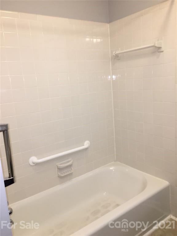 3633 Kempton Place Charlotte, NC 28208 - Photo 23 of 32 a bathroom with a shower