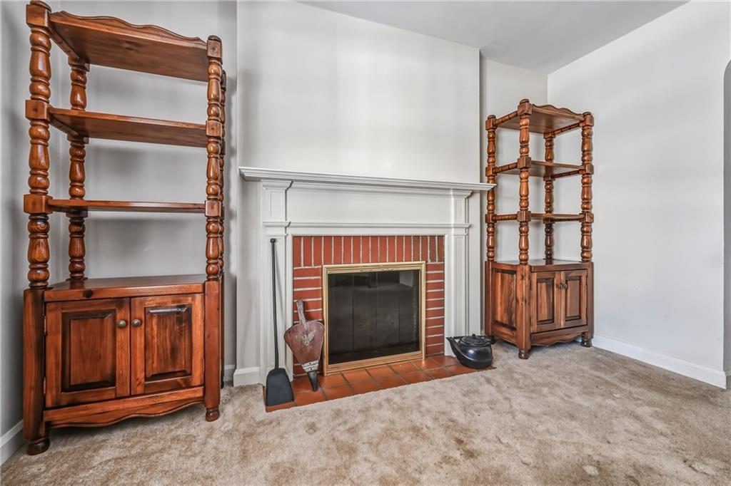 513 Dougherty Avenue Sharon, PA 16146 - Photo 5 of 28 a living room with furniture and a fireplace