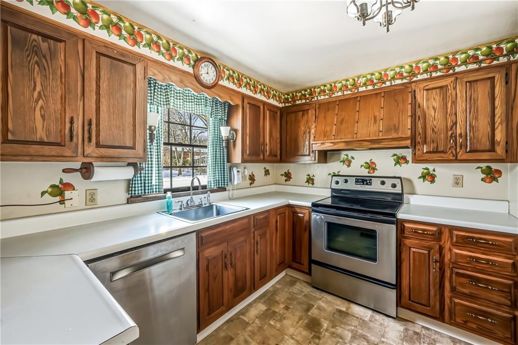 513 Dougherty Avenue Sharon, PA 16146 - Photo 10 of 28 a kitchen with stainless steel appliances granite countertop a sink stove and cabinets