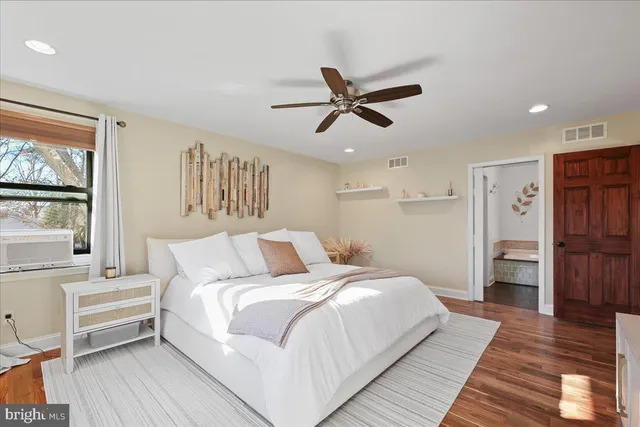 a bathroom with a tub sink and window