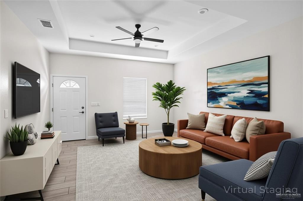 1511 Playa Drive, Unit 2 Weslaco, TX 78596 - Photo 12 of 28 a living room with furniture and a flat screen tv
