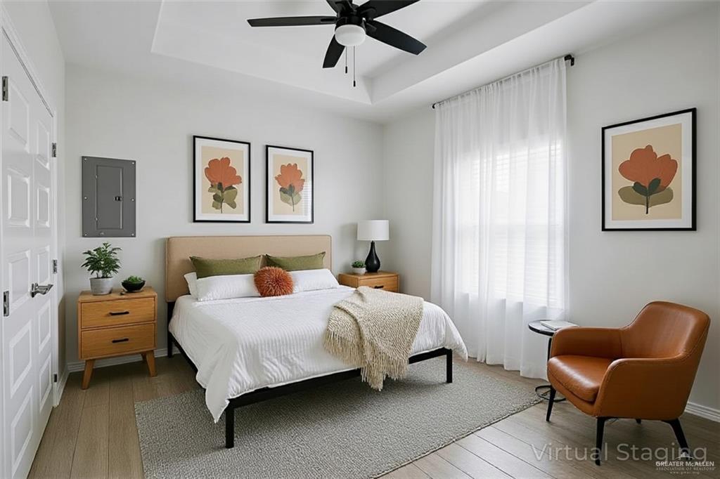 1511 Playa Drive, Unit 2 Weslaco, TX 78596 - Photo 18 of 28 a bedroom with a bed and a window