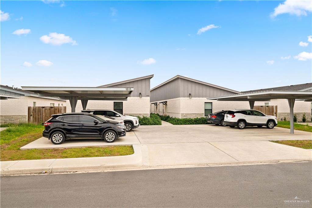 1511 Playa Drive, Unit 2 Weslaco, TX 78596 - Photo 2 of 28 a front view of a house with parking space