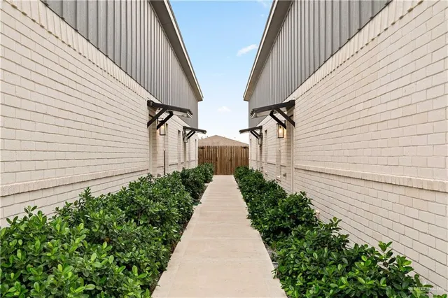 a view of a pathway with house on both side view