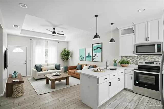 a living room with furniture and a fireplace