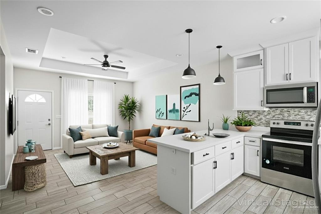 1511 Playa Drive, Unit 2 Weslaco, TX 78596 - Photo 10 of 28 a living room with furniture and a fireplace