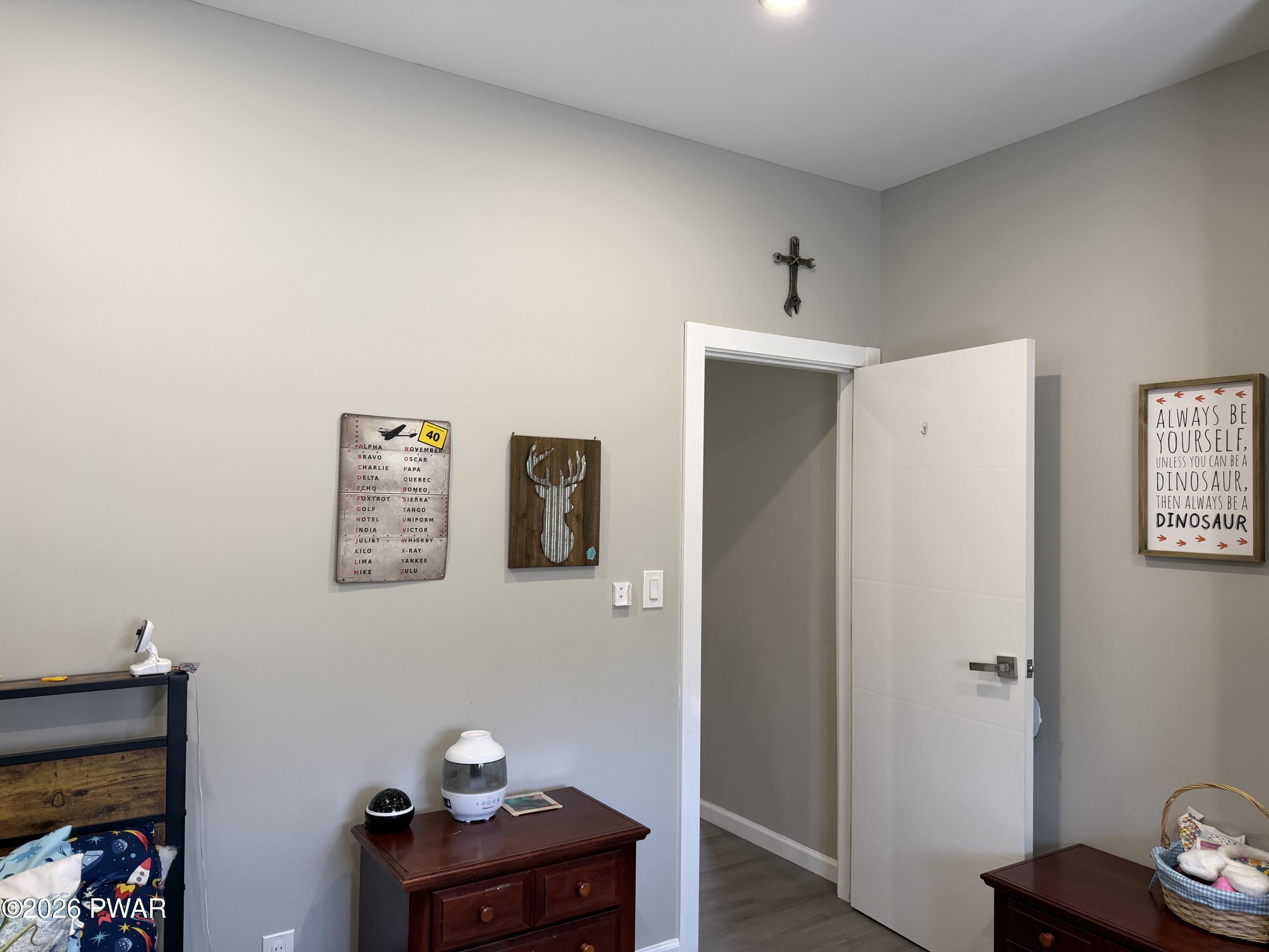 801 Maple Ridge Court Hawley, PA 18428 - Photo 37 of 55 a workspace with furniture and wooden floor