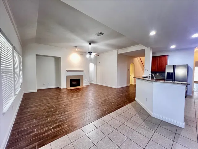 a view of a kitchen with microwave and cabinets