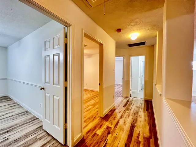 a view of a bathroom with a shower and a tub