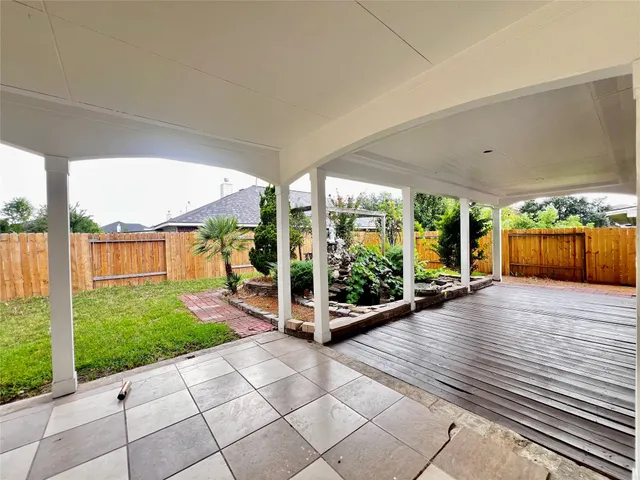 a view of a garden with an outdoor seating