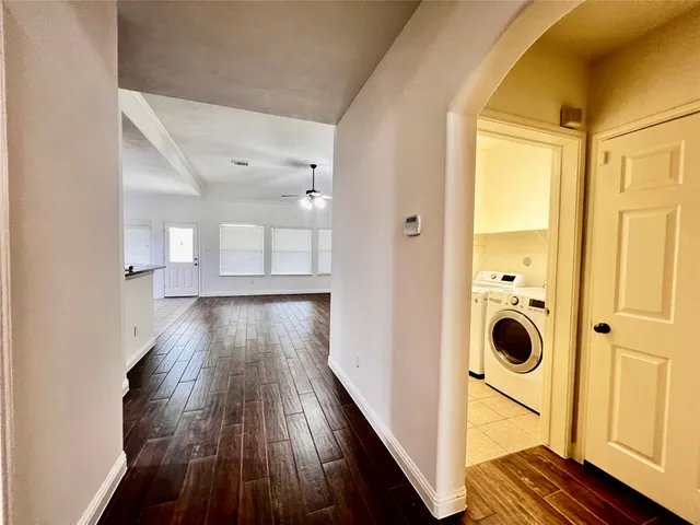 a view of entryway with wooden floor