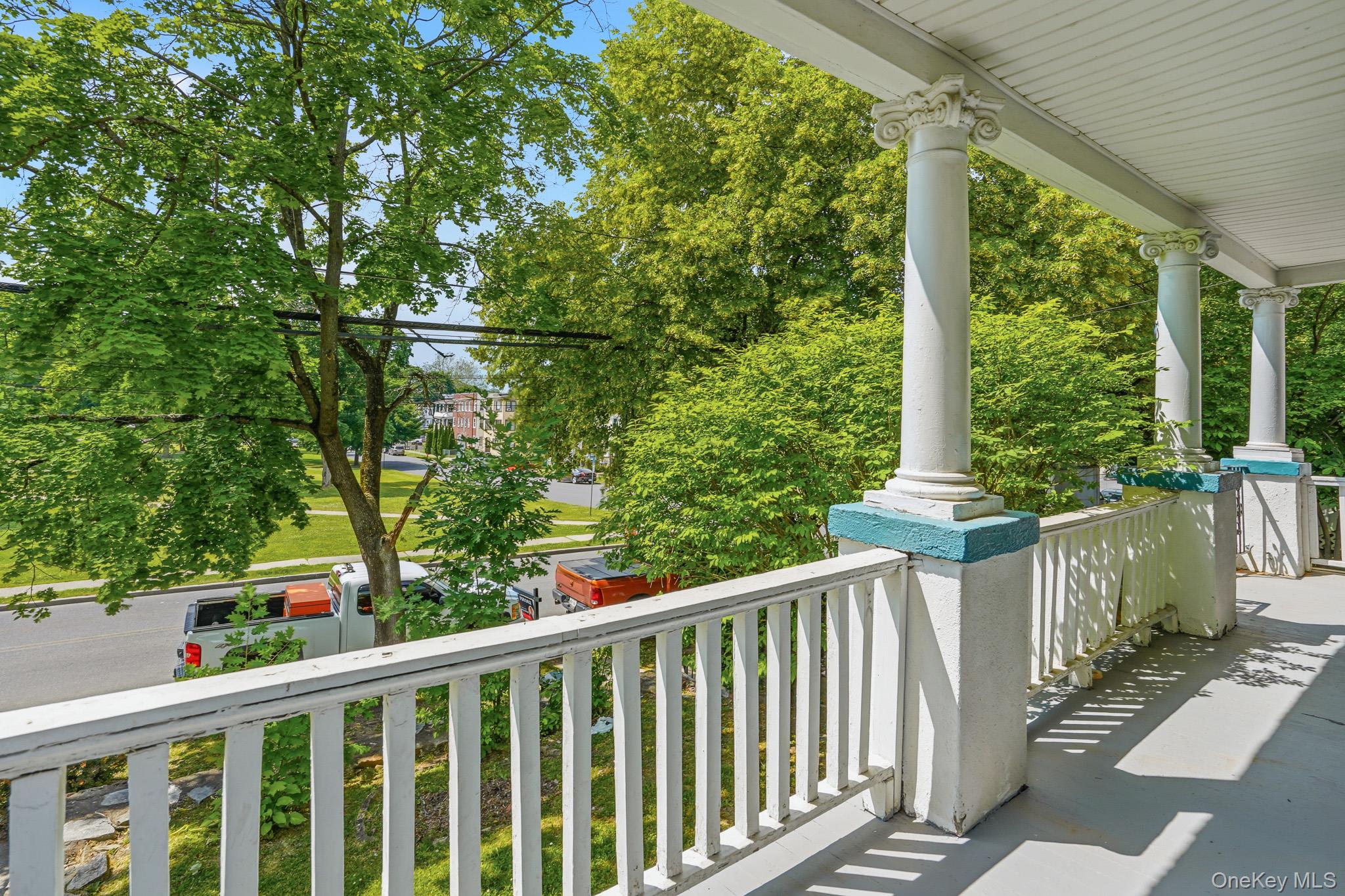 65 North Clinton Street Poughkeepsie, NY 12601 - Photo 4 of 43 a balcony with trees in front of it