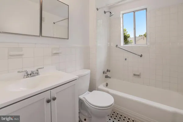 a bathroom with a sink toilet and bathtub