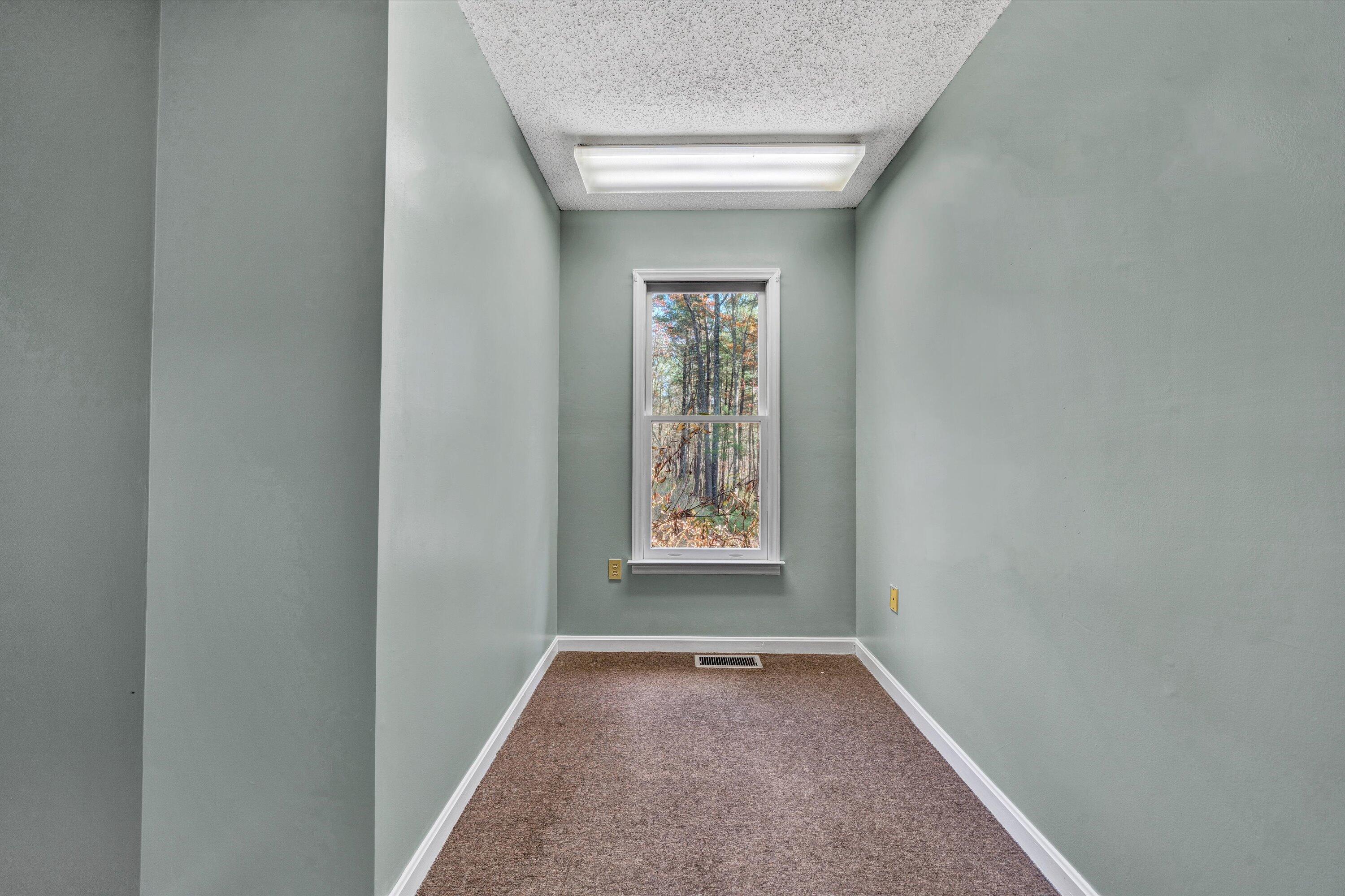 1685 Highland Farm Road Callaway, VA 24067 - Photo 17 of 36 a view of an empty room and window