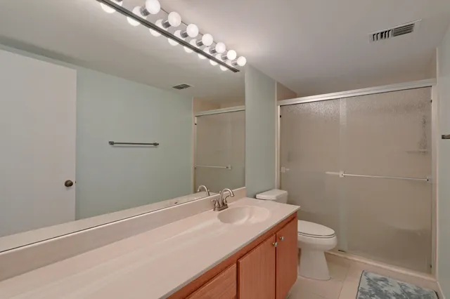 a bathroom with a shower and a tub