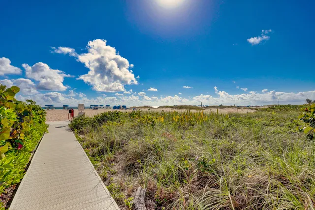 a kitchen with stainless steel appliances granite countertop a refrigerator and stove