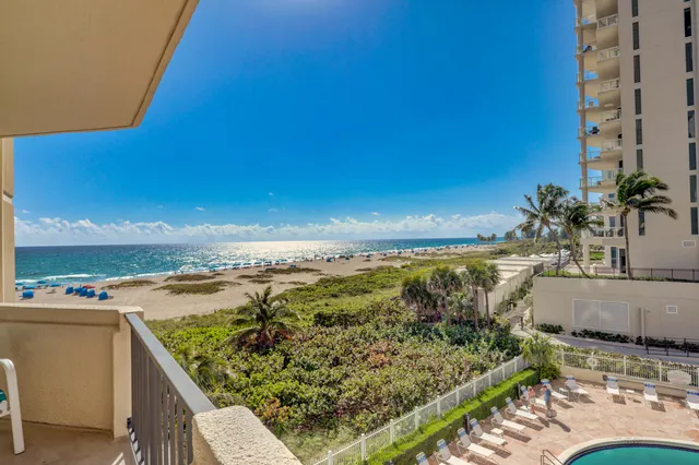 a view of a terrace with a lake view