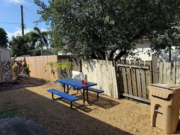 a bench sitting in front of a tree