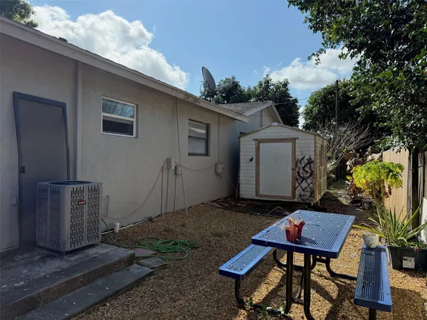 a backyard of a house with seating space