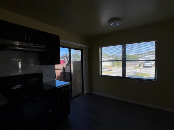 a kitchen with stainless steel appliances a stove